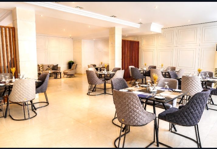 Chopped Bistro — elegant dining hall with quilted chairs